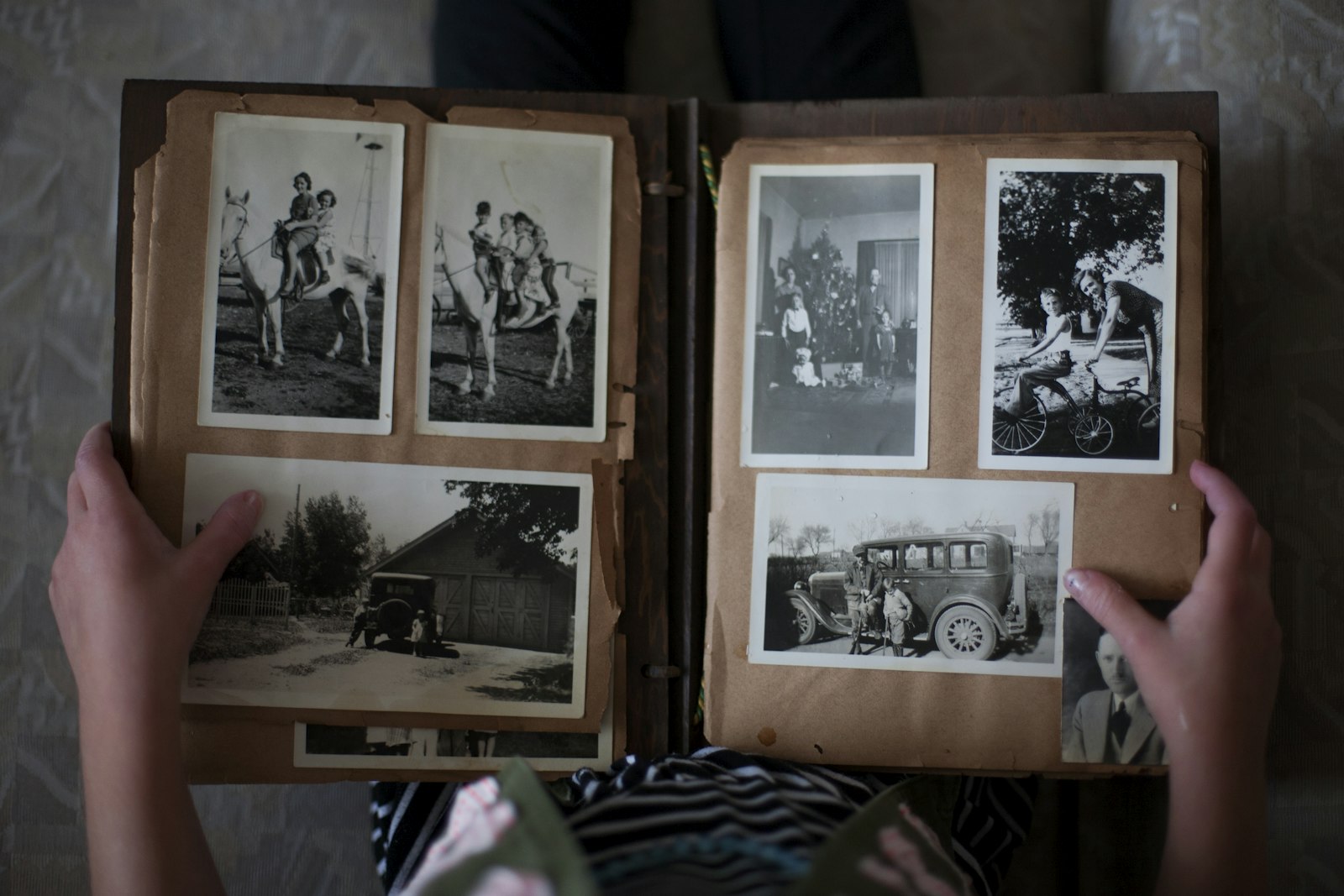 An elderly couple looking at old family photographs